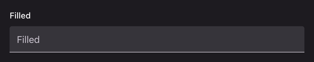 A filled text input on a tinted container with a rule beneath it