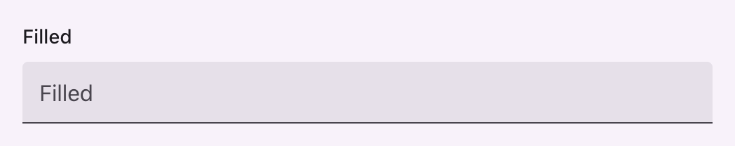 A filled text input on a tinted container with a rule beneath it